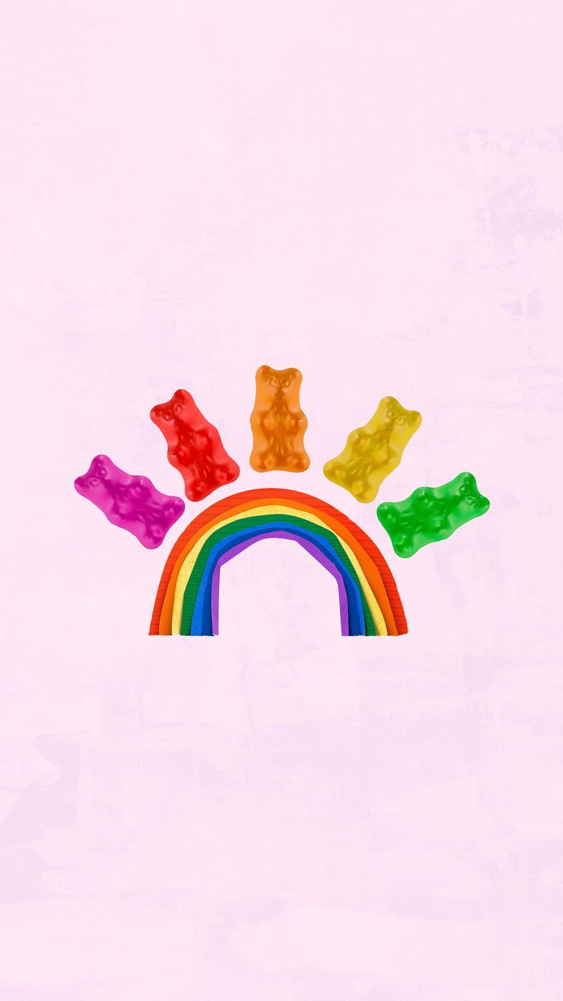 A phone wallpaper of a rainbow with gummy bears on it. - Gay, LGBT, food