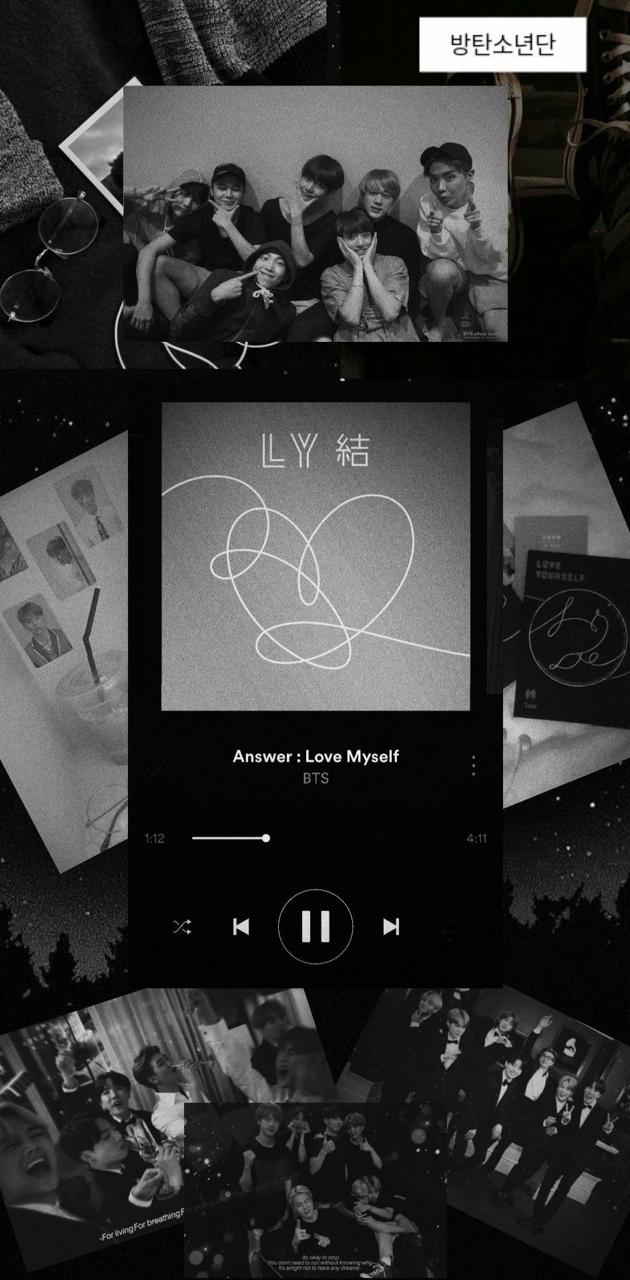 A black and white image of a phone screen with the BTS app open. - Gray, BTS
