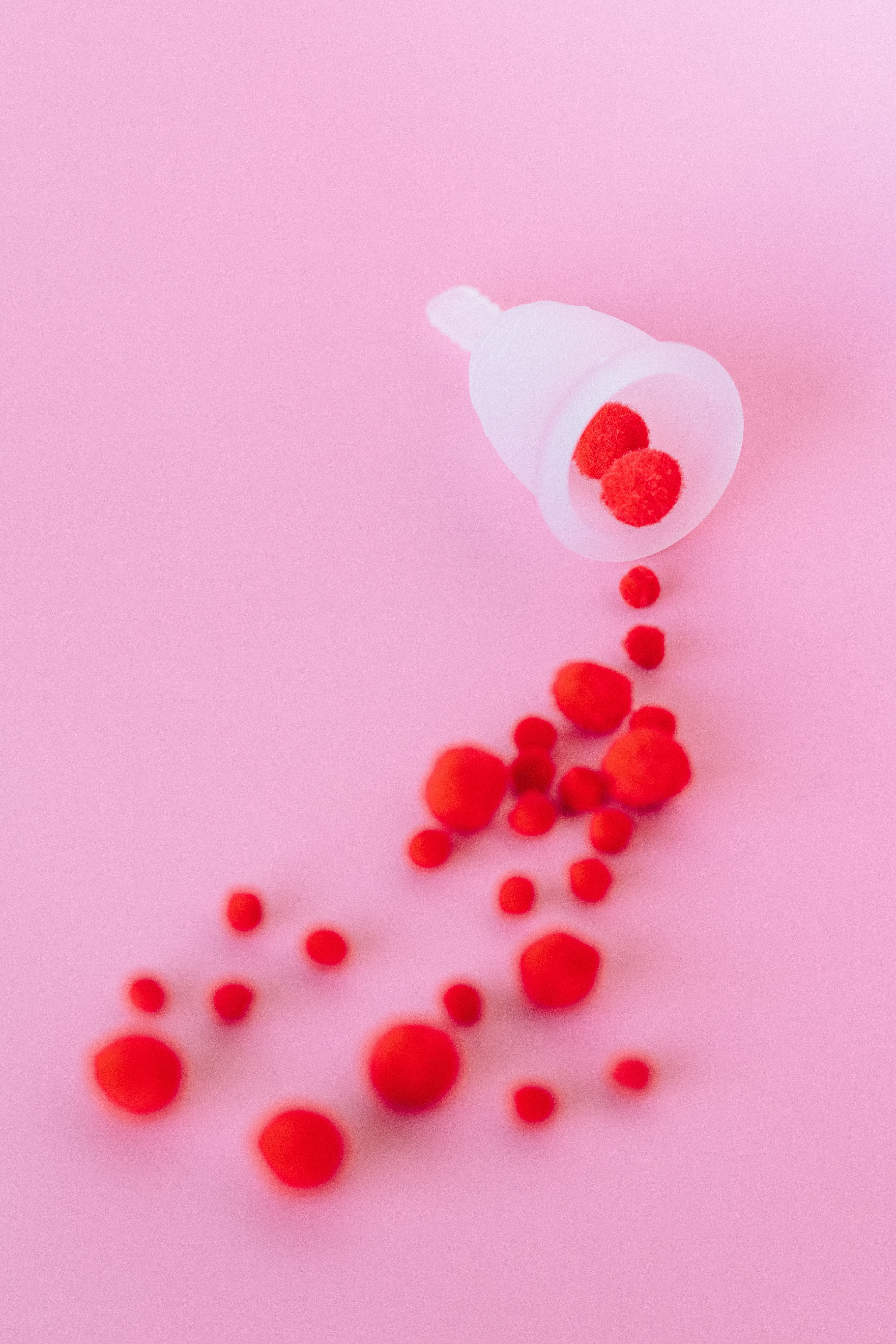 A red liquid is being poured into the cup - Blood