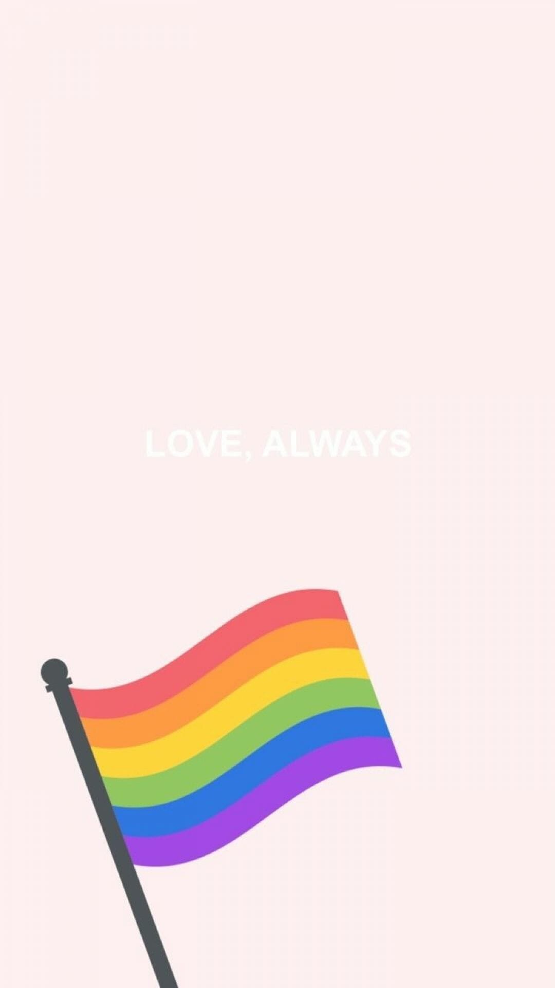 A pride flag waving in the wind with the text 