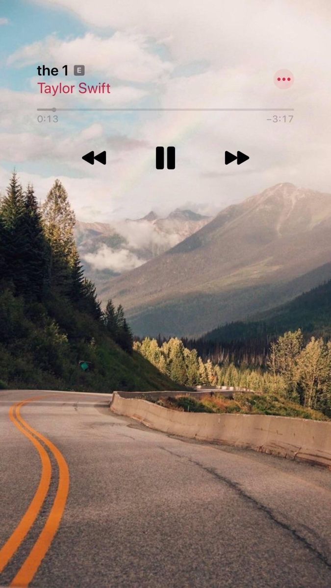 A Taylor Swift album cover is shown on a phone screen with a background of a road. - Taylor Swift, music