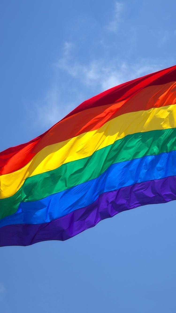 A rainbow flag waving in the wind - Gay, LGBT