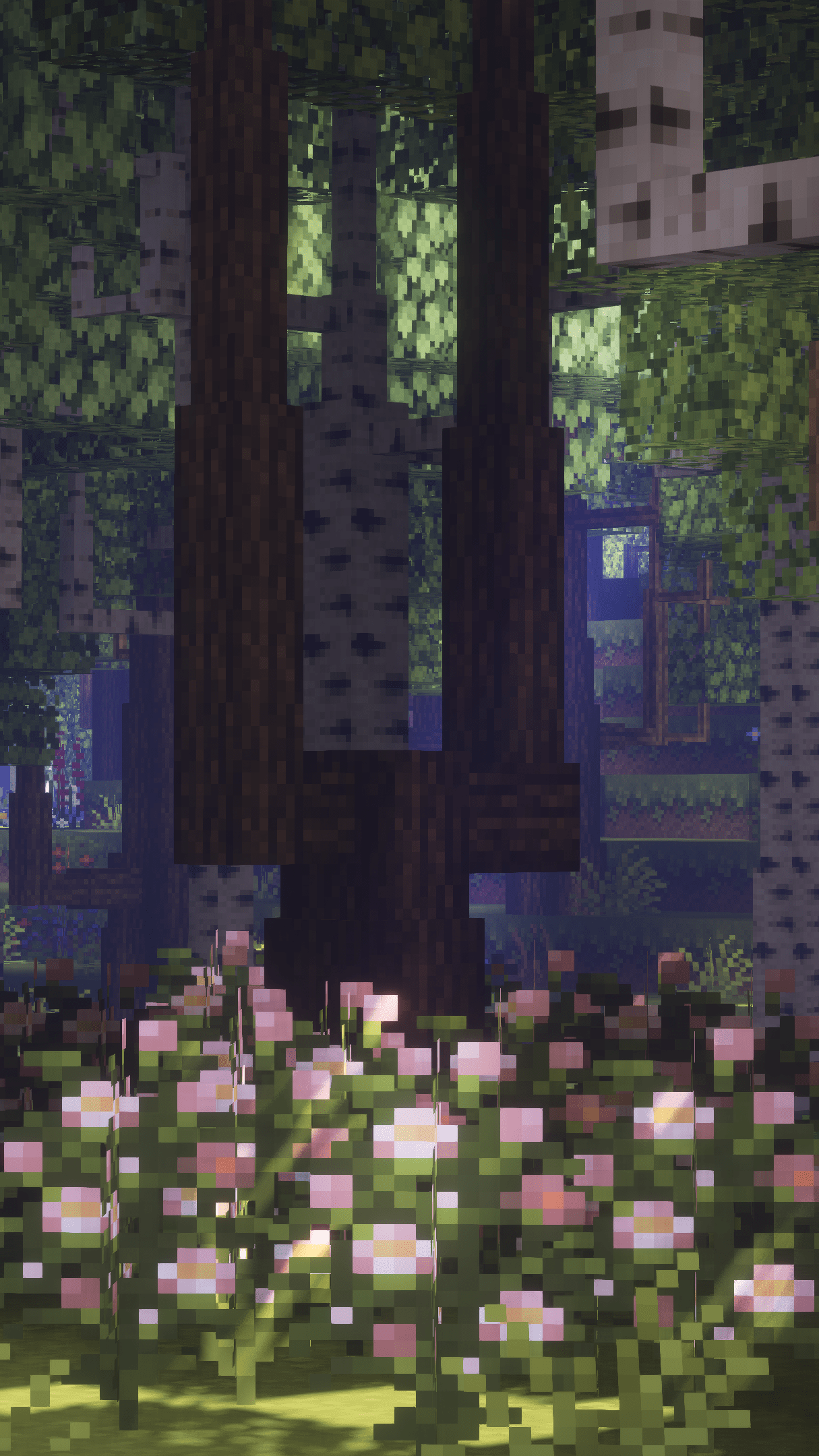 A Minecraft screenshot of a forest with a tree stump in the foreground and a small house in the background. - Minecraft