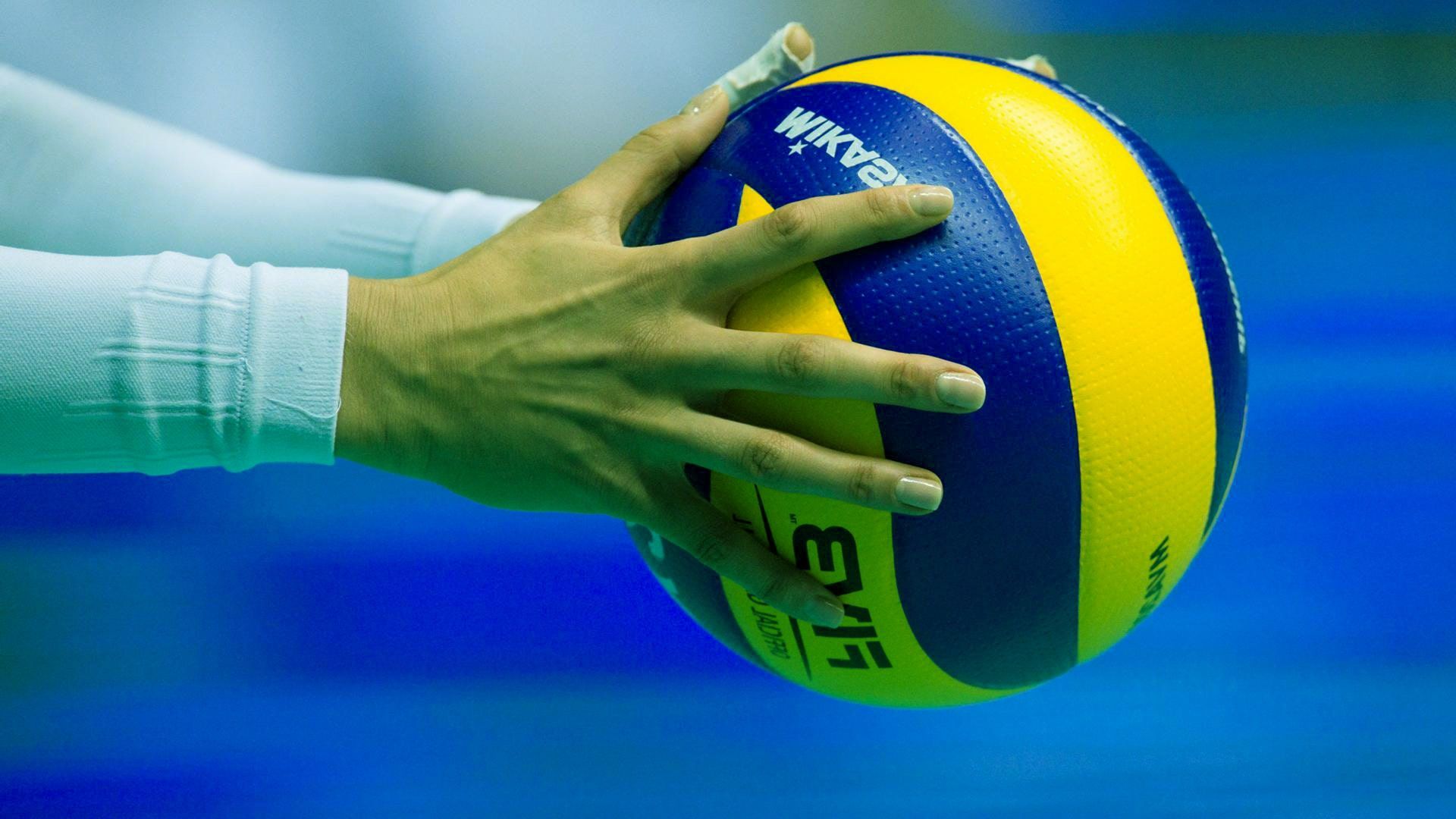 Volleyball player passing the ball during a game - Volleyball