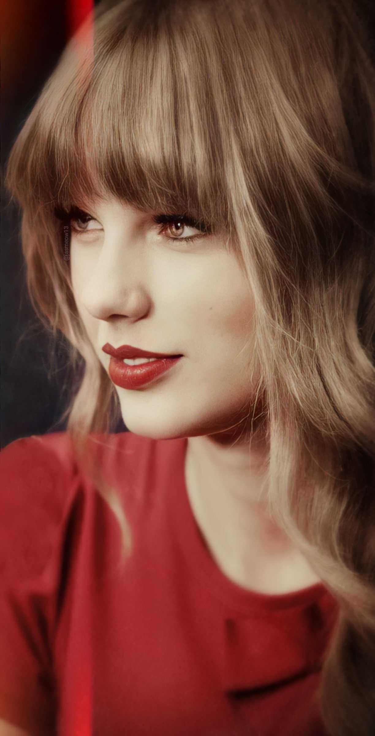 A woman in red shirt and lipstick - Taylor Swift