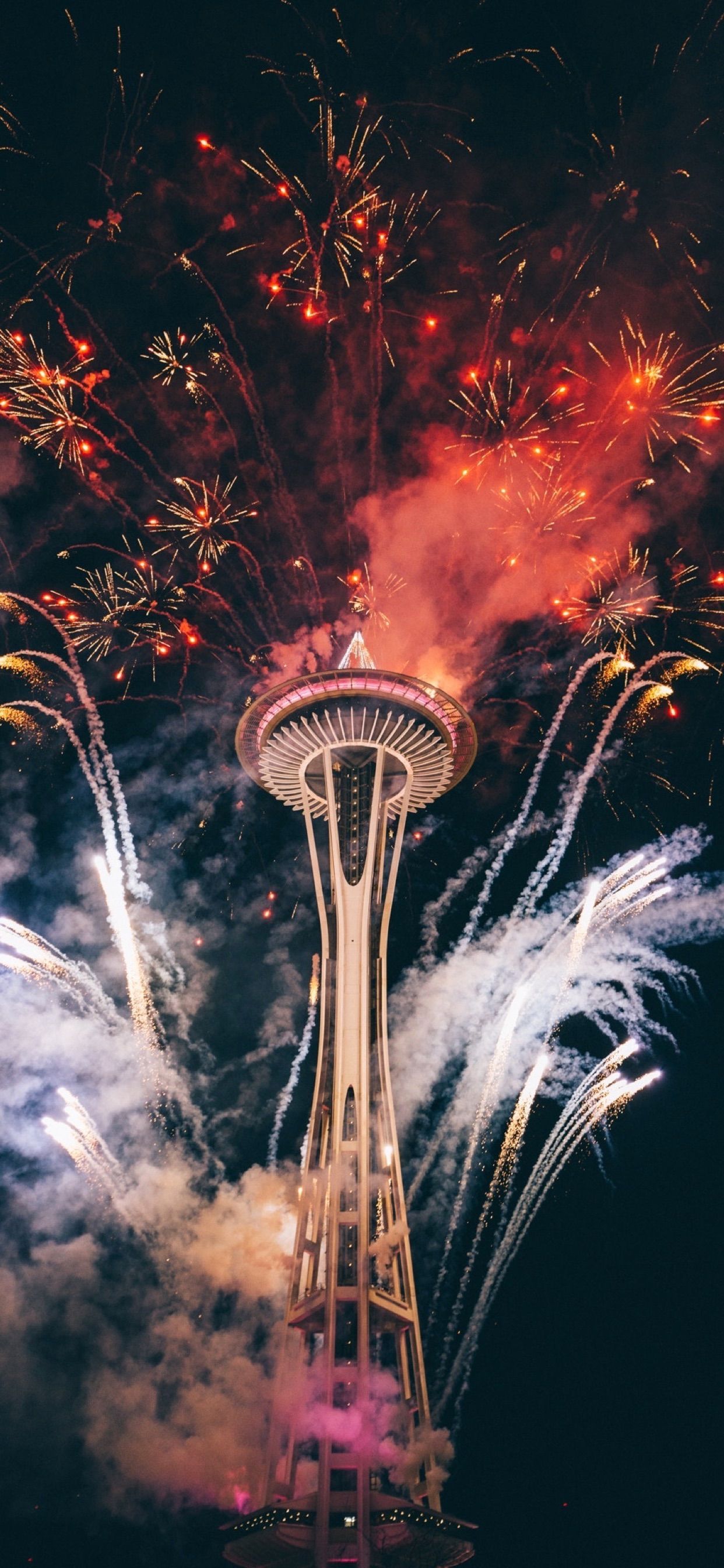 Fireworks light up the sky behind the Space Needle in Seattle. - New Year