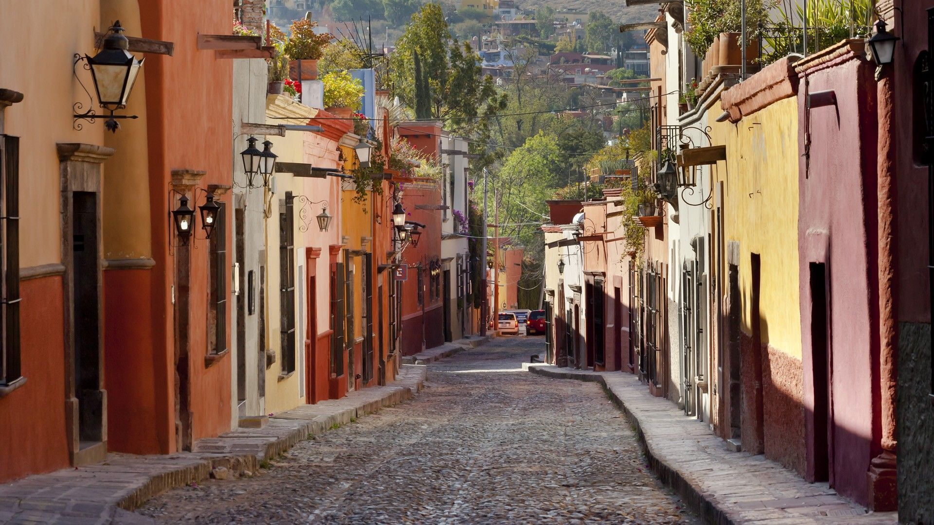 A narrow street with buildings on either side - Mexico