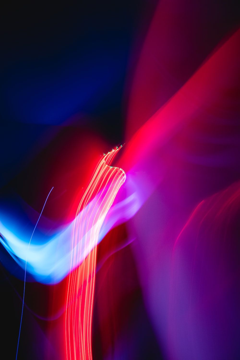 A blurry image of light in motion - Neon red, neon, light red