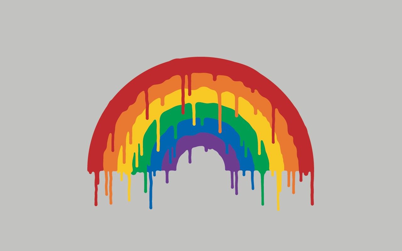 A rainbow is painted on a grey background. - Rainbows, pride