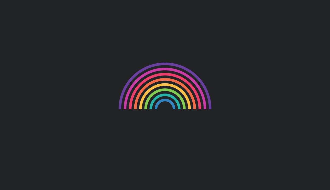 A black background with a colorful rainbow in the center - Rainbows