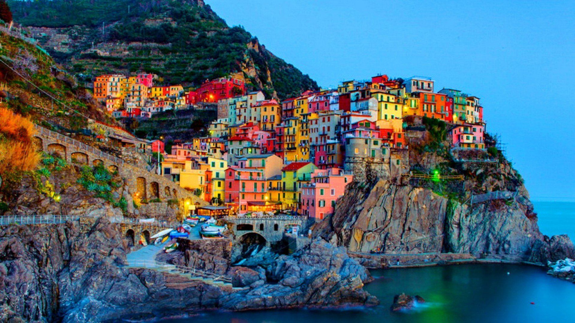 A colorful village is built on the side of cliff - Italy