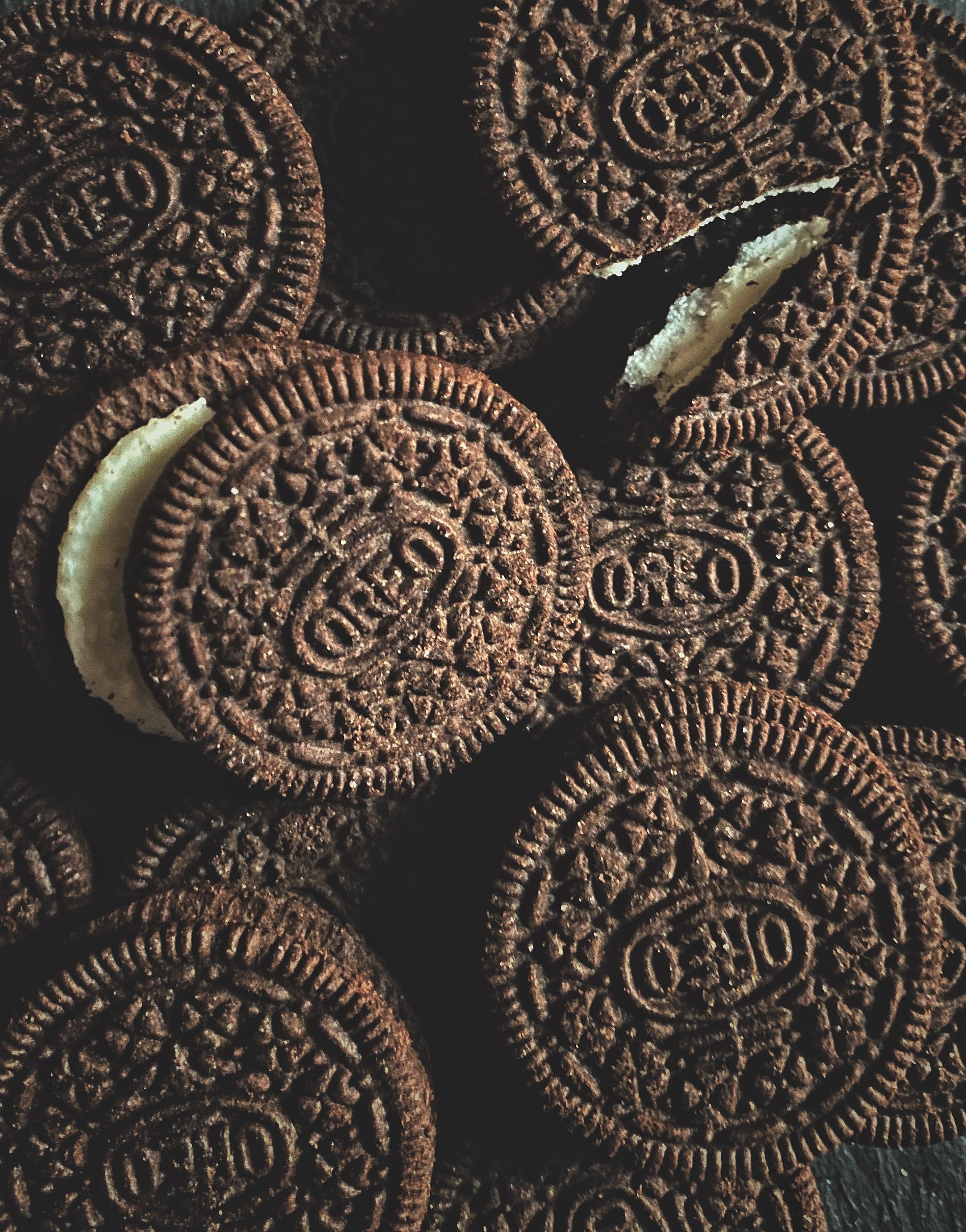 A pile of oreo cookies with some missing - Oreo