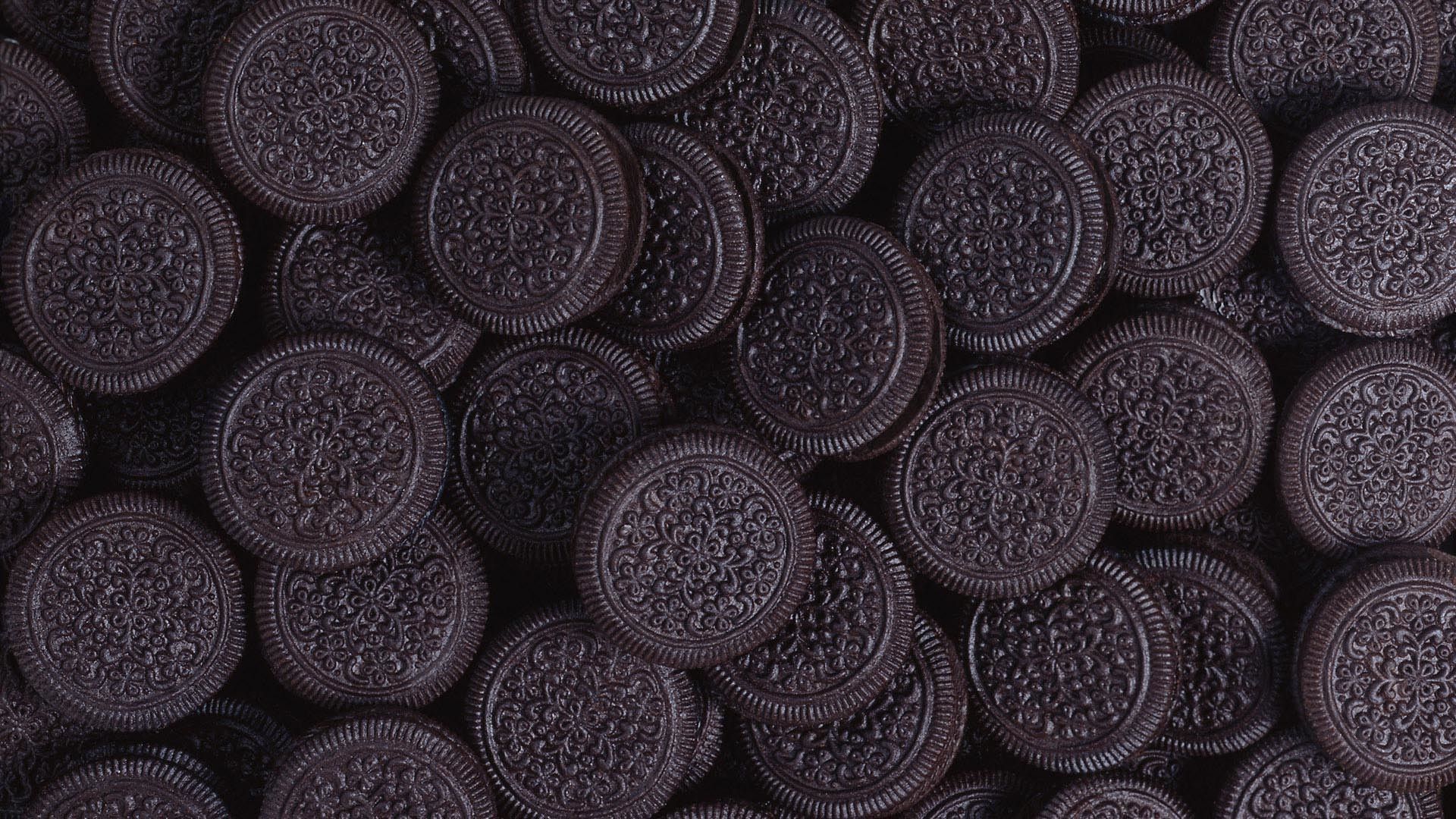 A close up of many chocolate cookies - Oreo