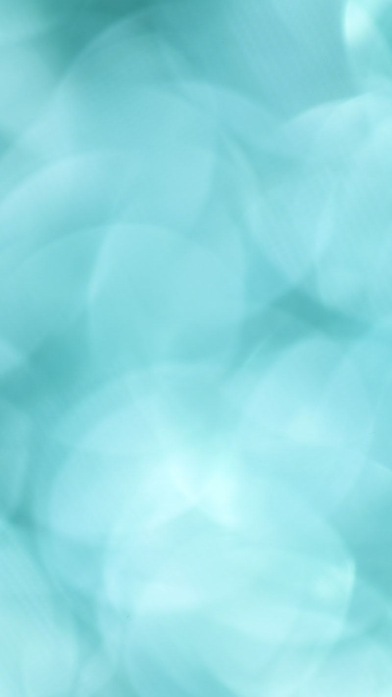 A soft blue abstract background with bokeh lights - Turquoise