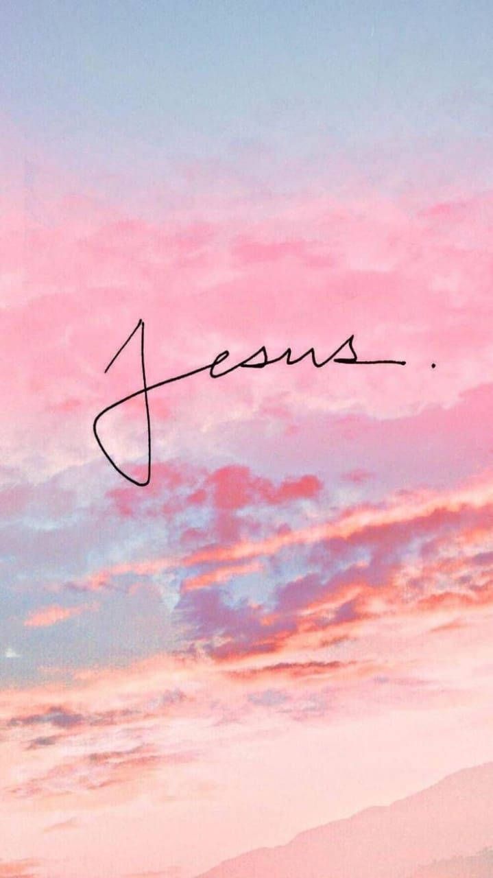A sunset with the word jesus written in pink - Jesus, sky
