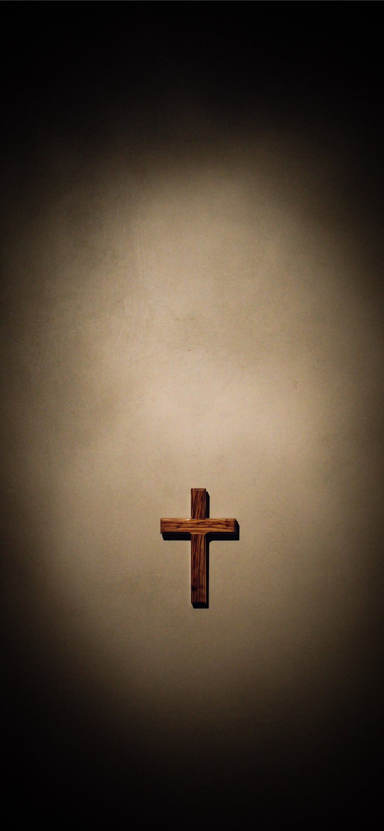 A cross is hanging on the wall - Cross