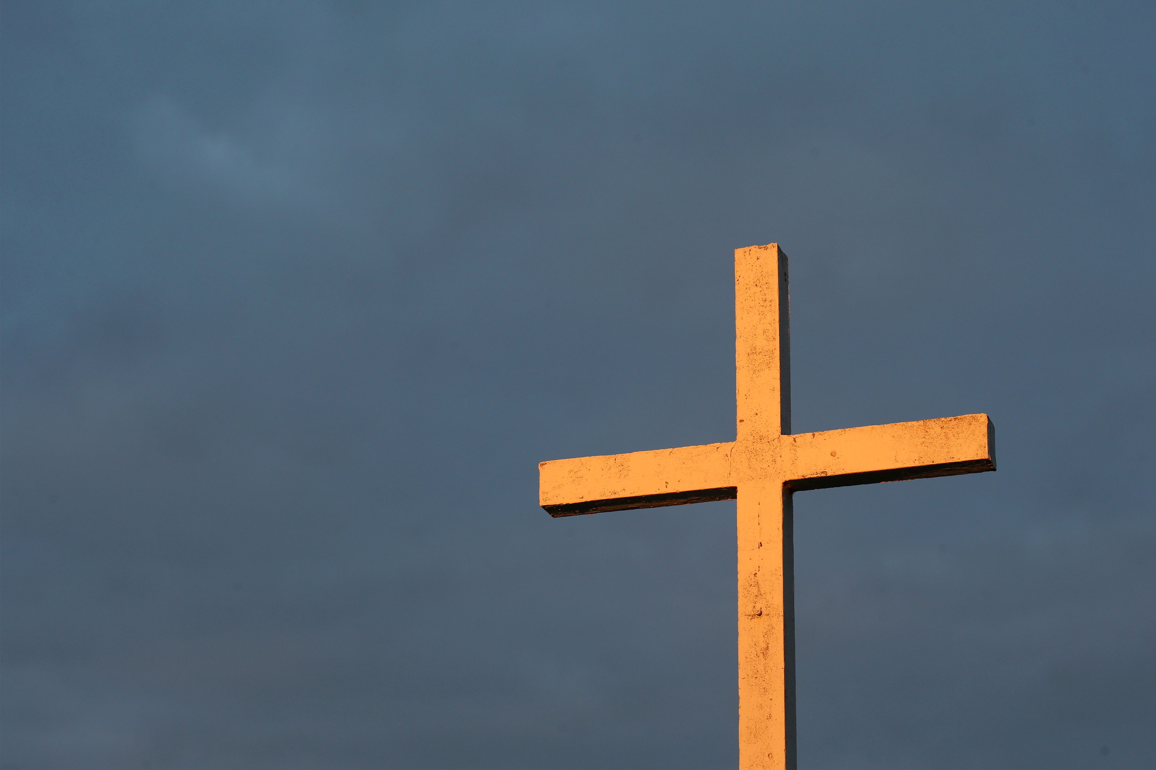 A cross is on top of the building - Cross