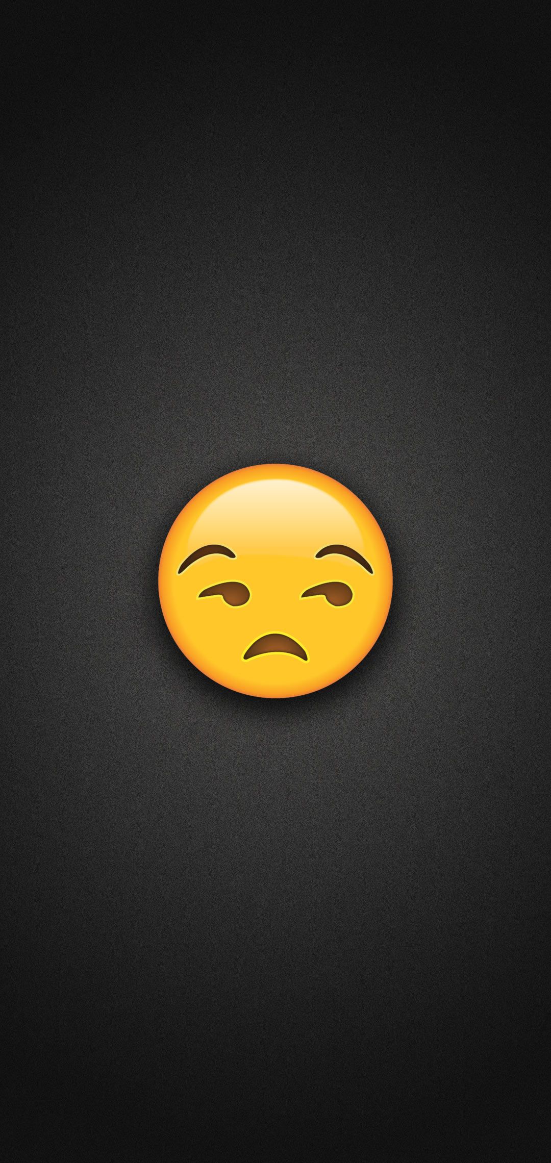 A black wallpaper with a yellow sad emoticon in the center - Emoji