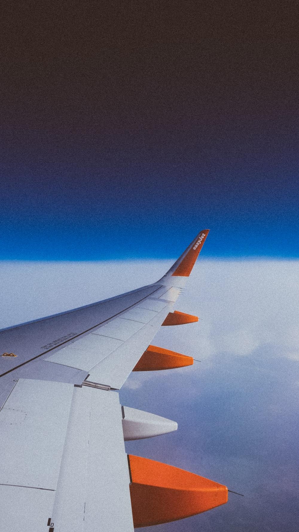 White and orange airplane wing - 