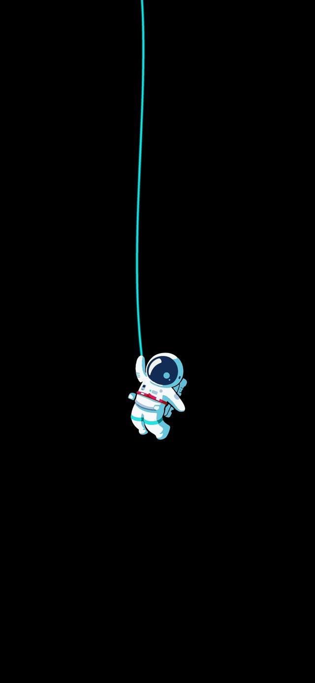 A space man is hanging from the ceiling - Apple Watch