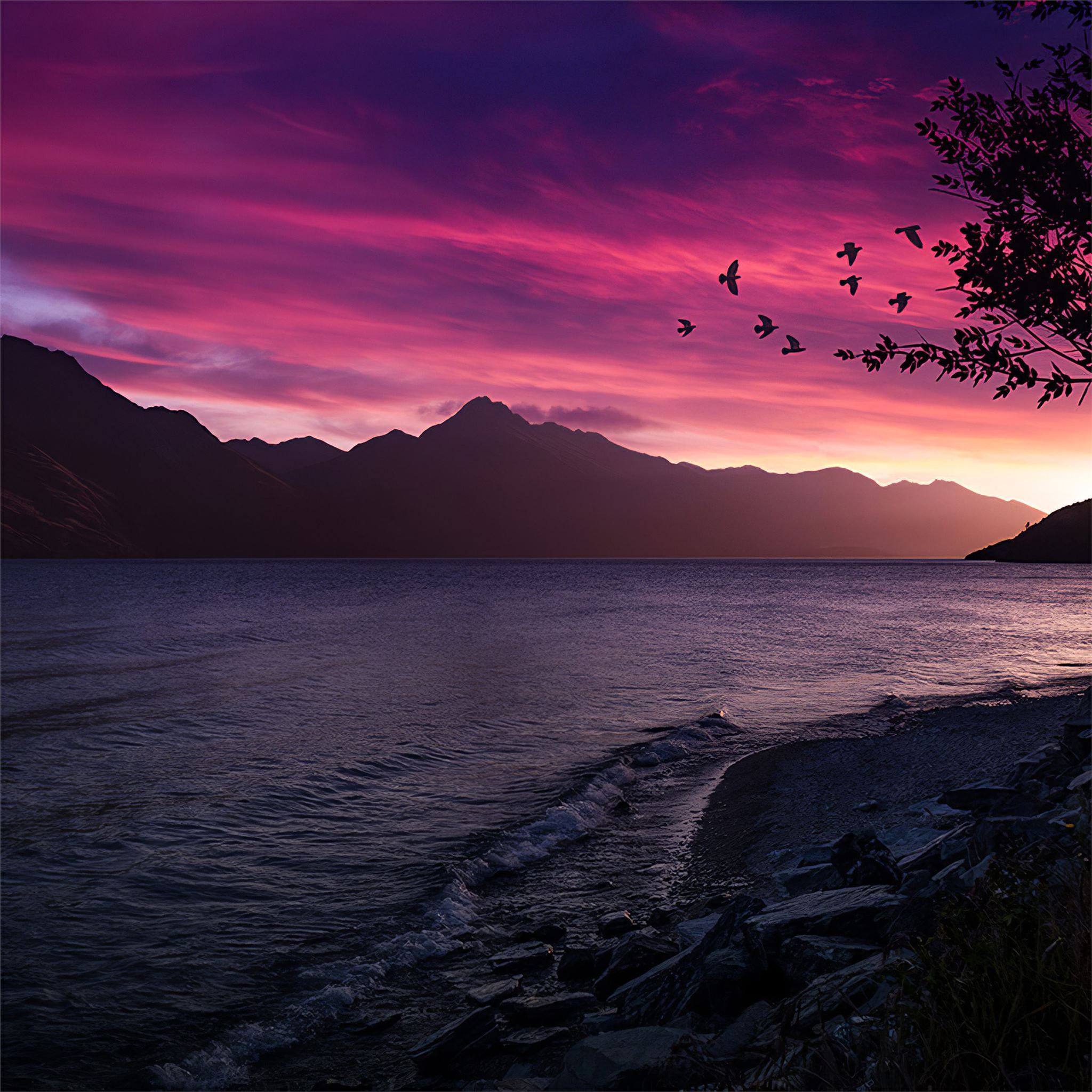 Birds flying over a lake during a purple sunset - Twilight