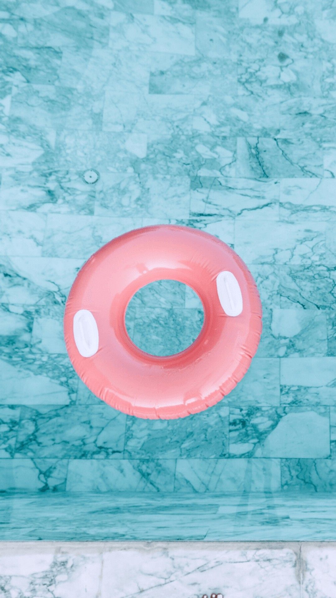 A person floating in the water with an inflatable ring - Summer