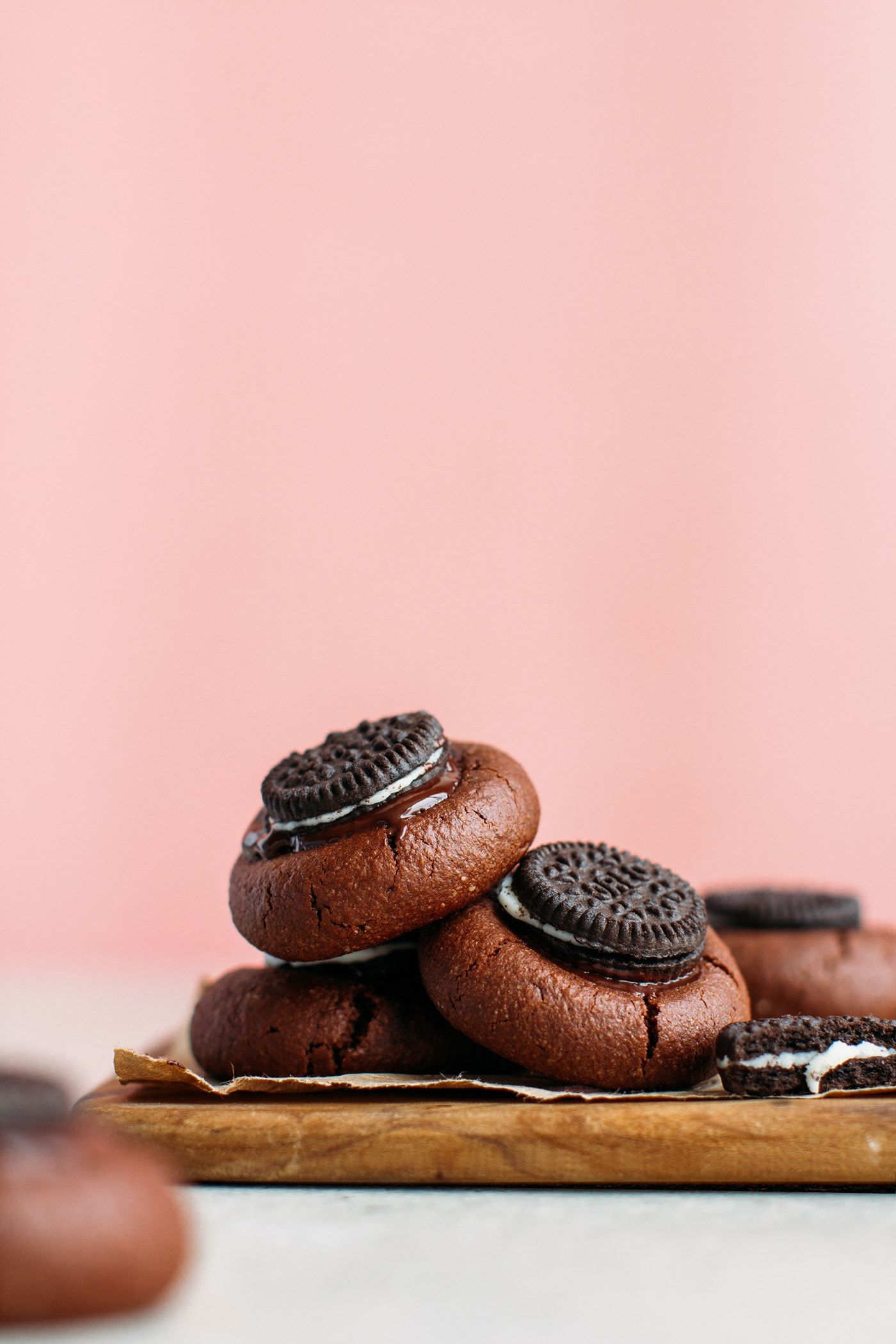 A stack of chocolate cookies with an Oreo stuffed in the middle - Oreo