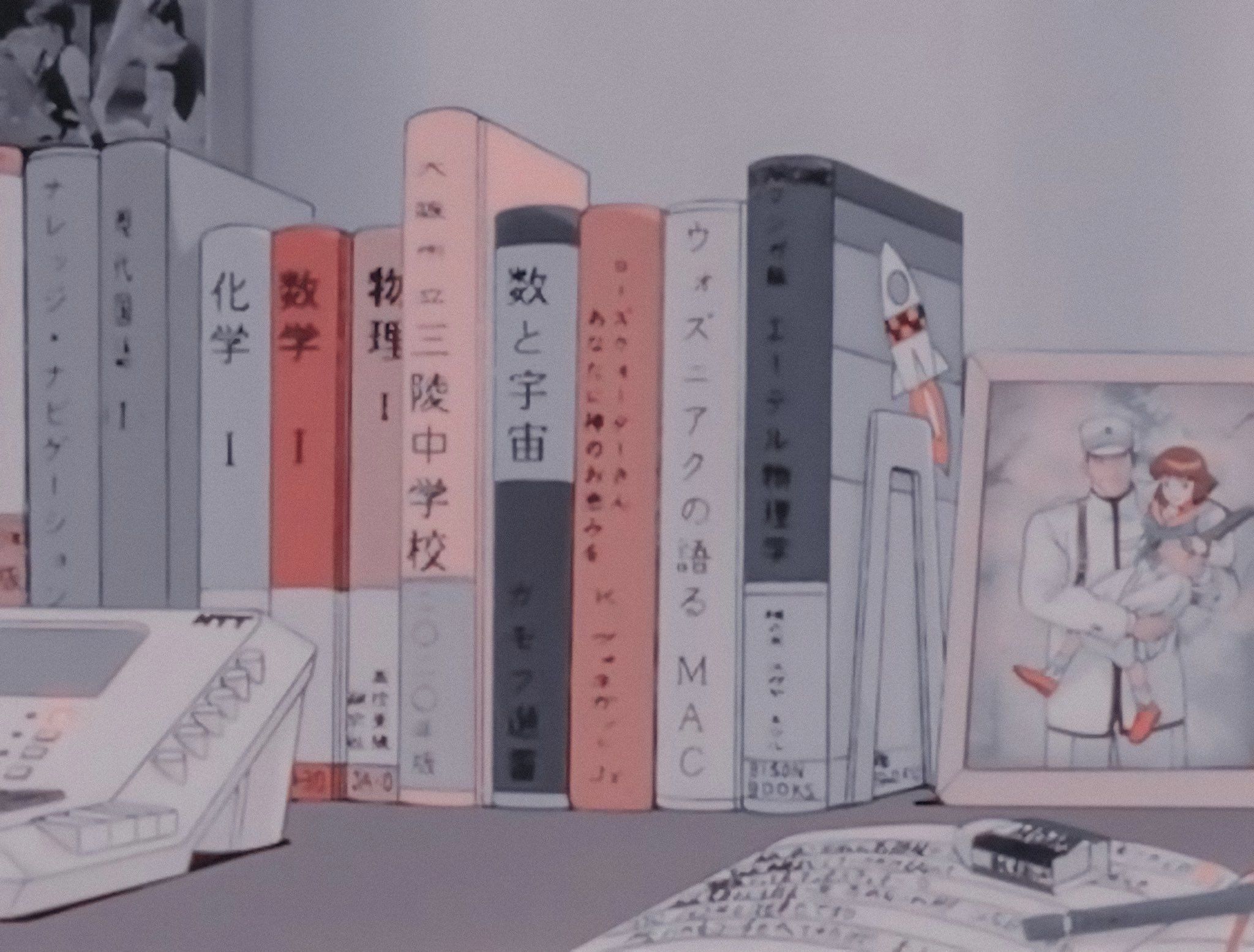 A collection of books on the table - 90s anime