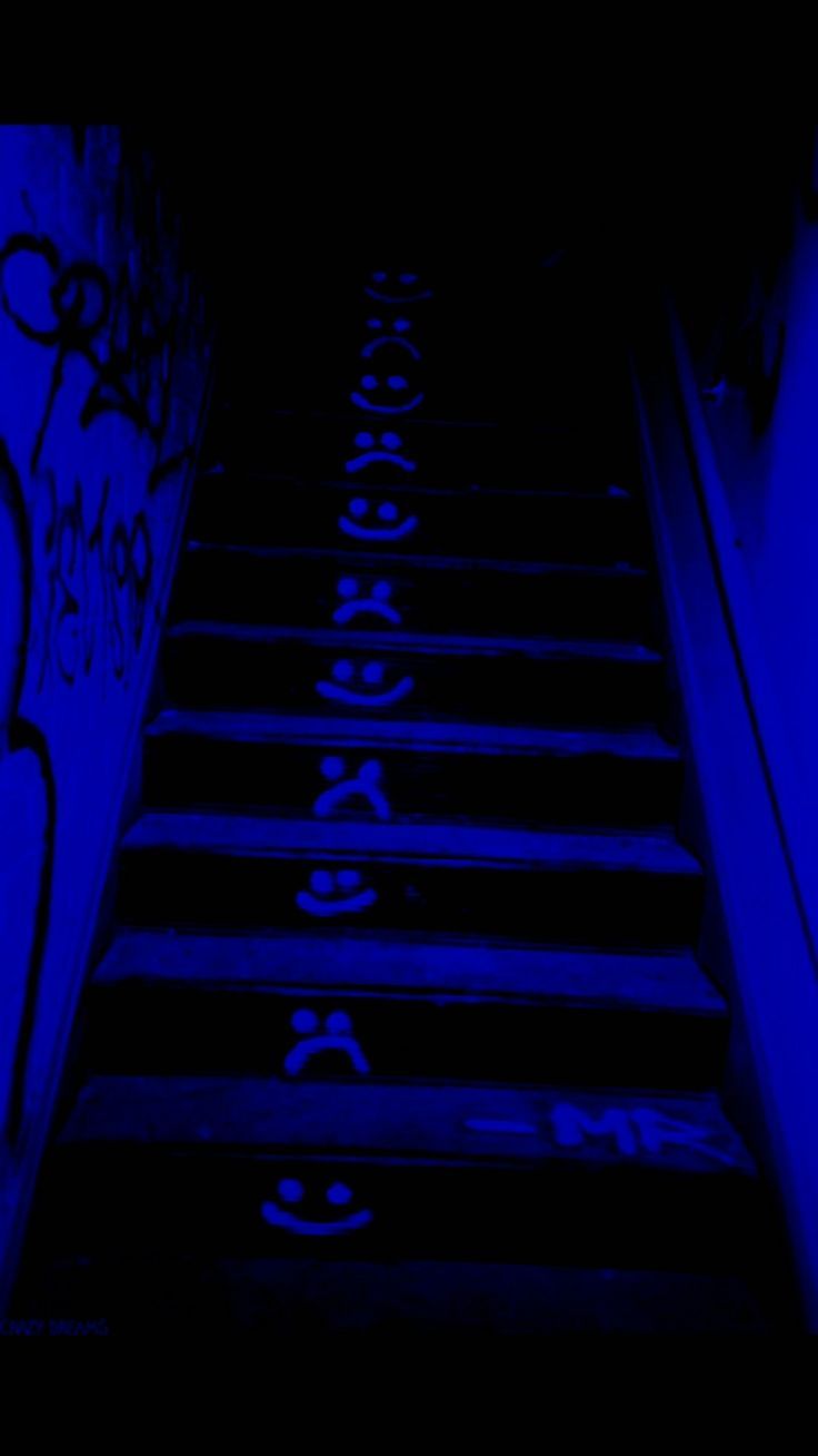 A stairway with graffiti on the walls - Navy blue