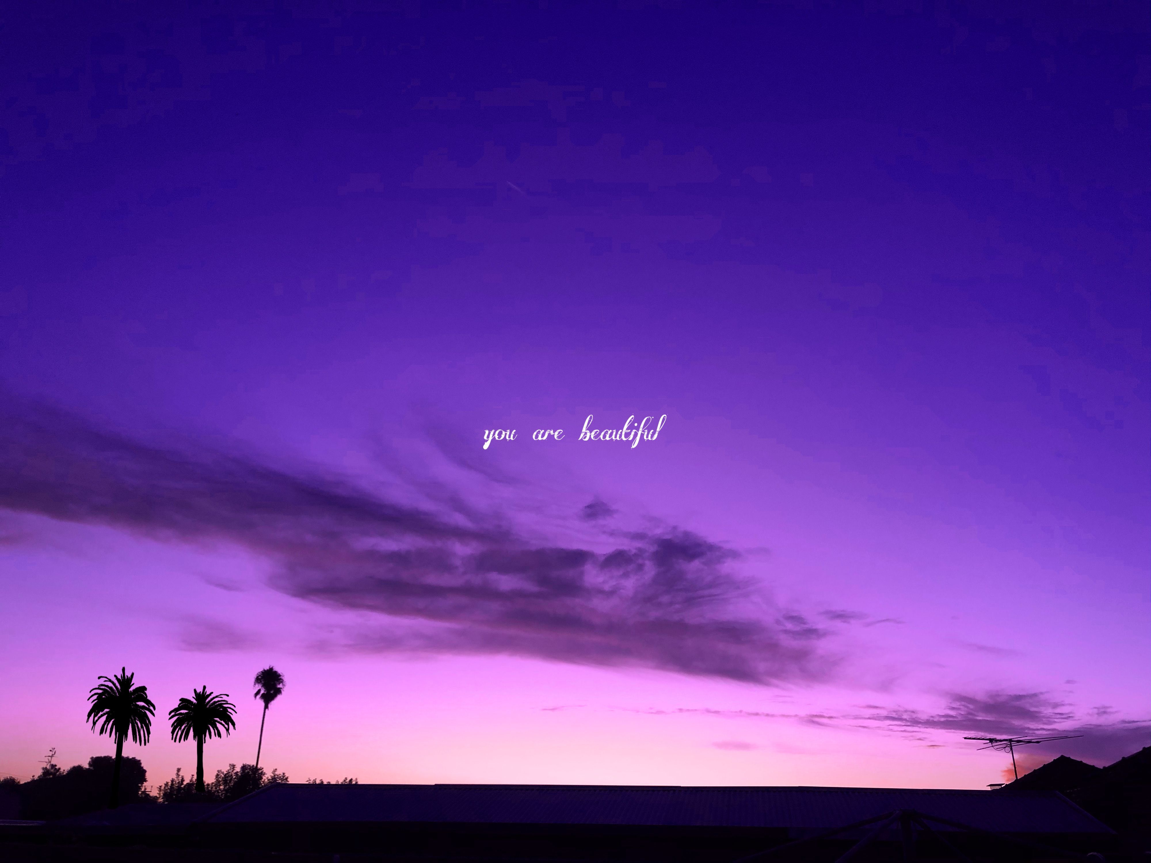 A purple and blue sunset with the words 