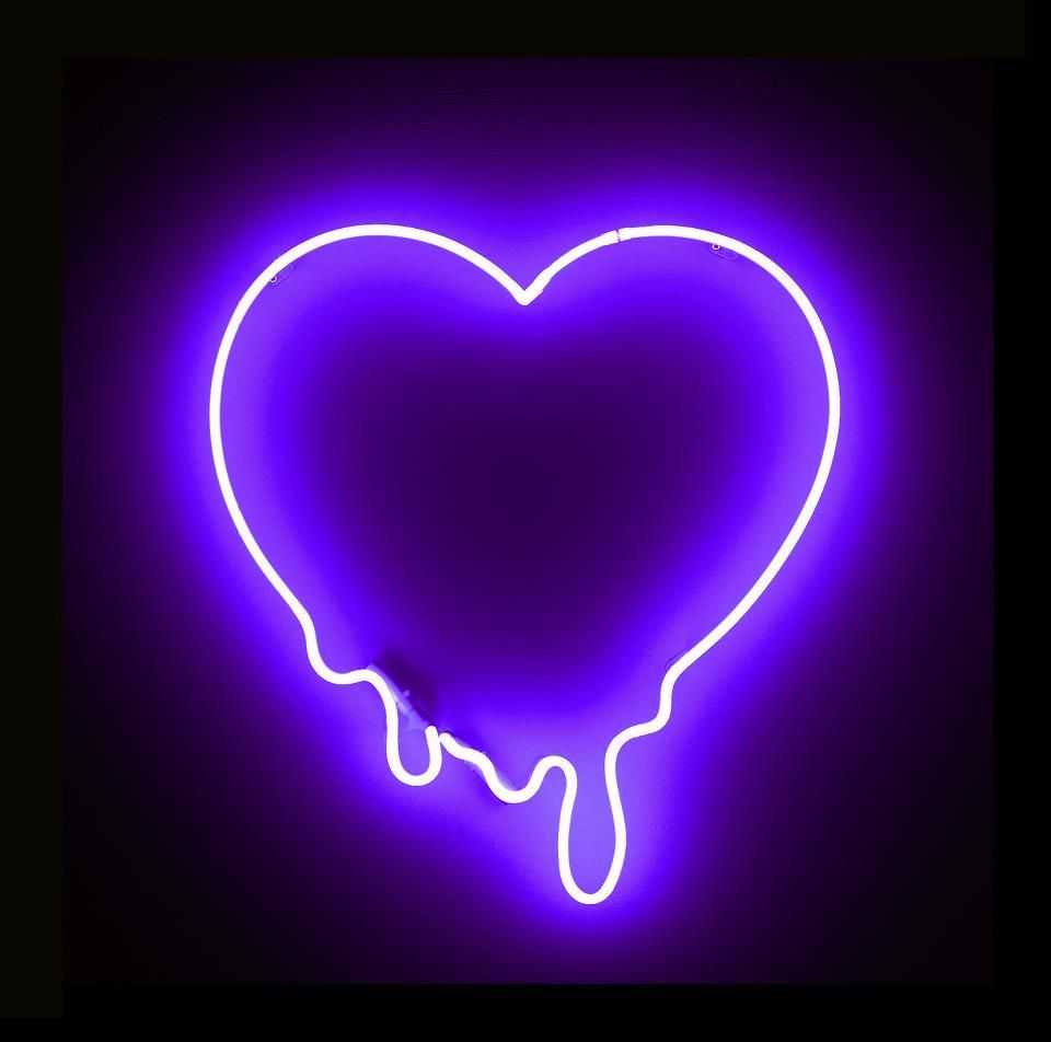 A neon sign of a heart in purple. - Purple quotes