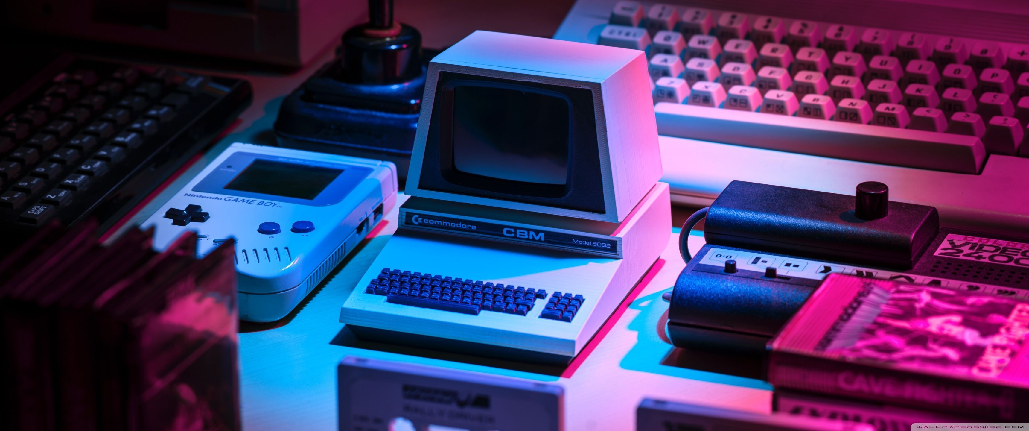 A computer and other electronic devices on display - 3440x1440