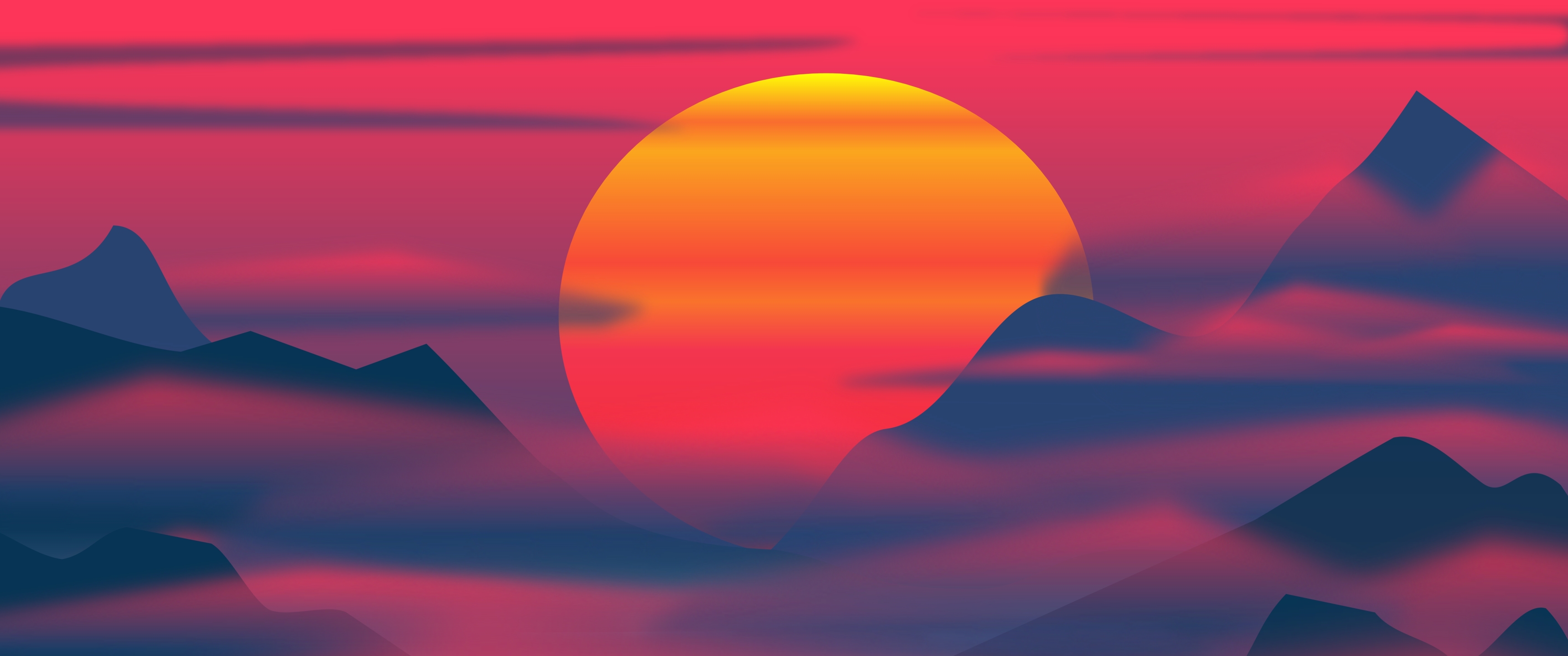 A sunset over mountains and hills - 3440x1440