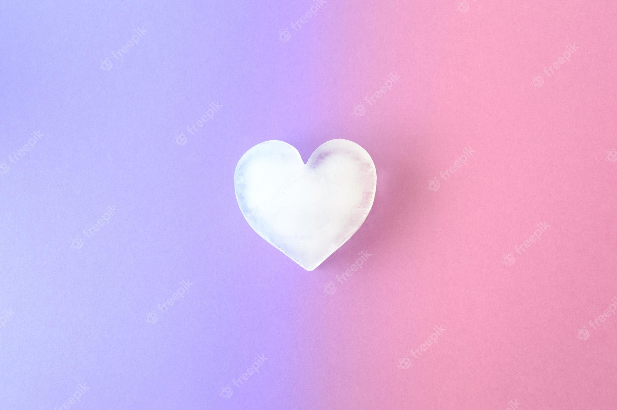 Premium Photo. Icy heart on a combination of purple and pink background colors valentines ice love aesthetic concept visual vibrant colors