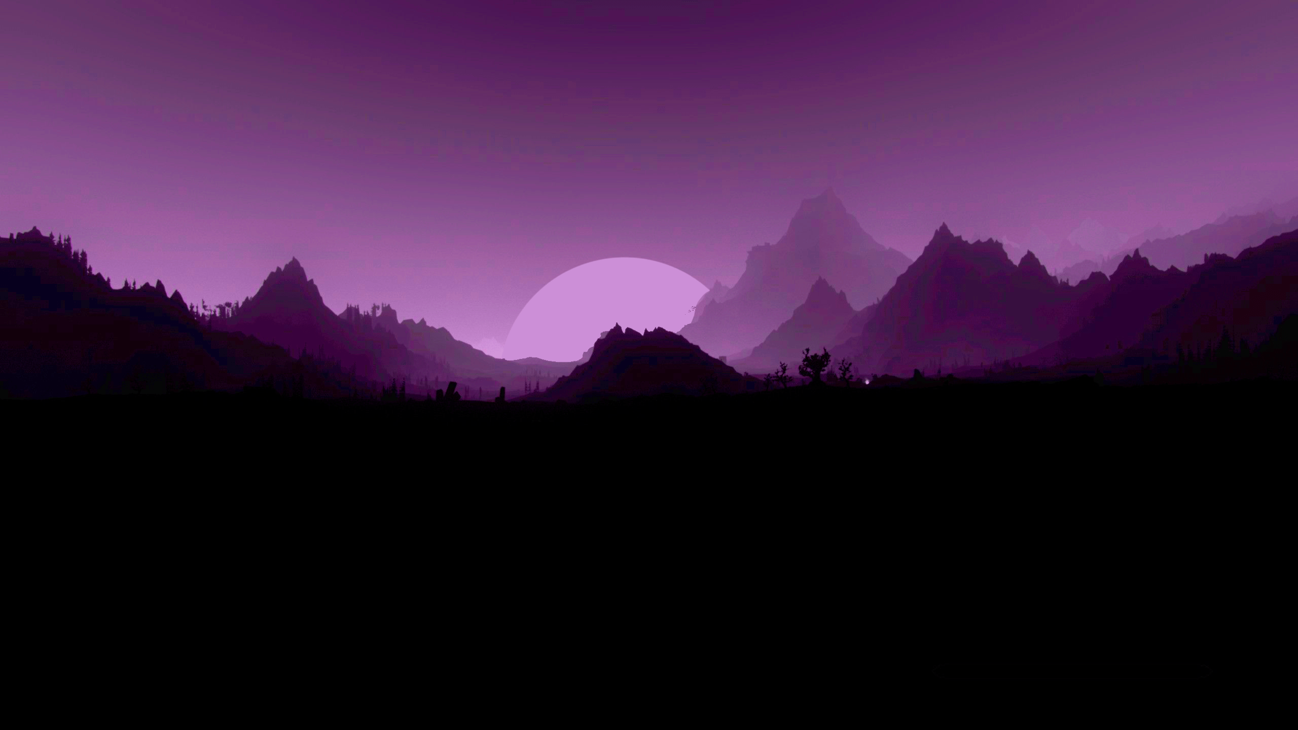 A purple sunset over a mountain range - 2560x1440