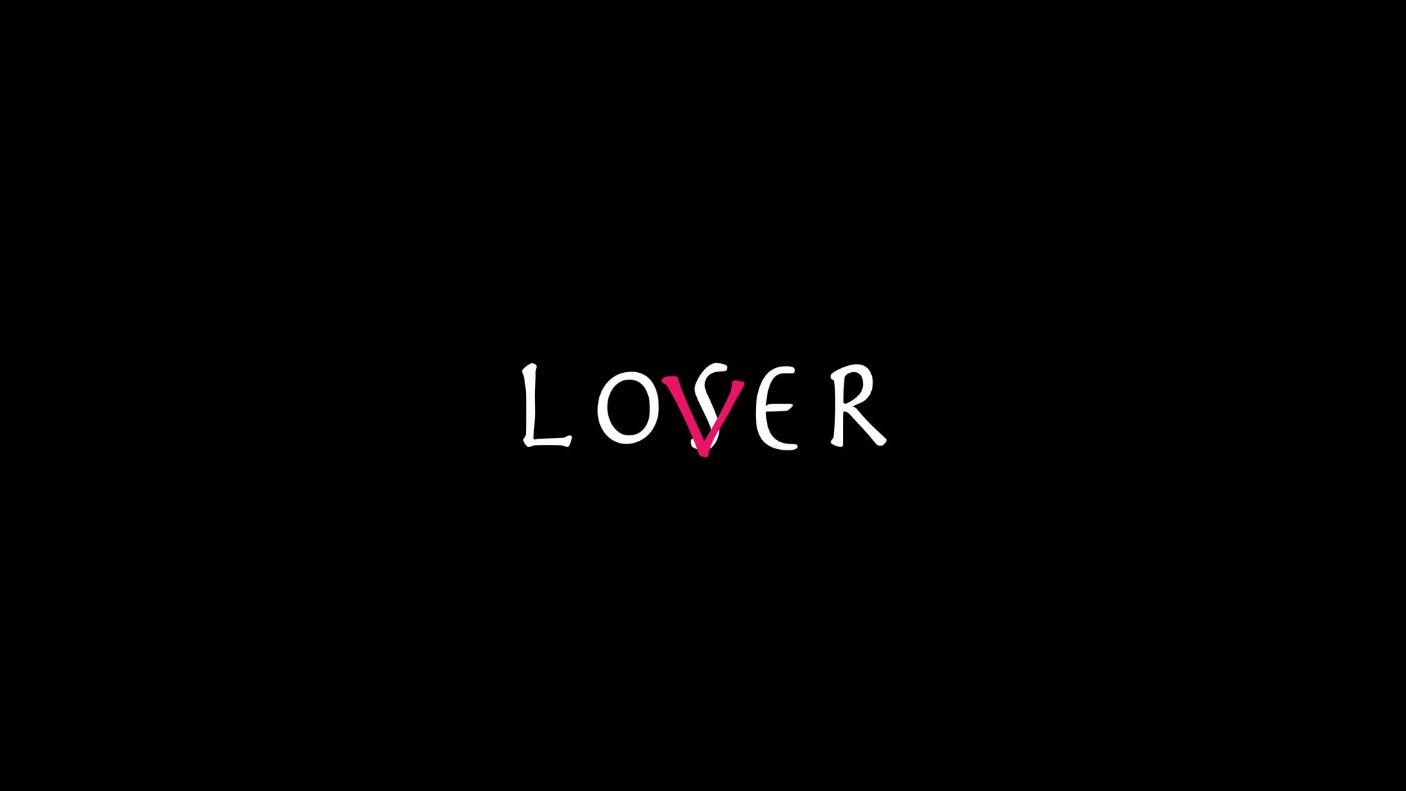 A black background with the word Lover in white and a pink heart - 2048x1152
