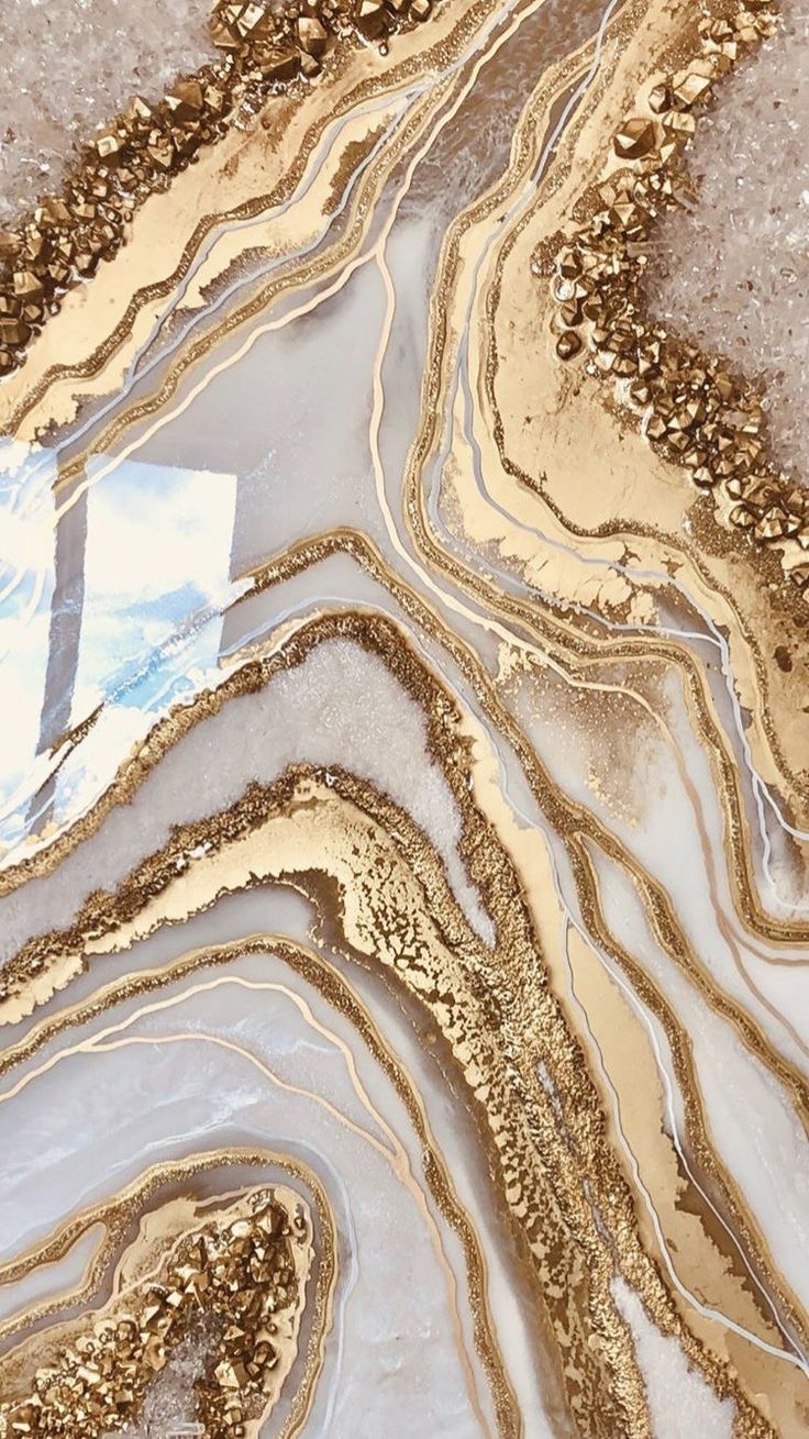A close up of gold and white marble - Gold