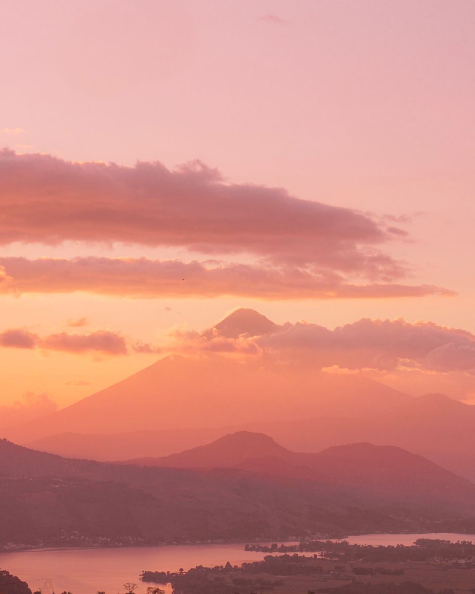 A pink sunset over a mountain and lake - Warm