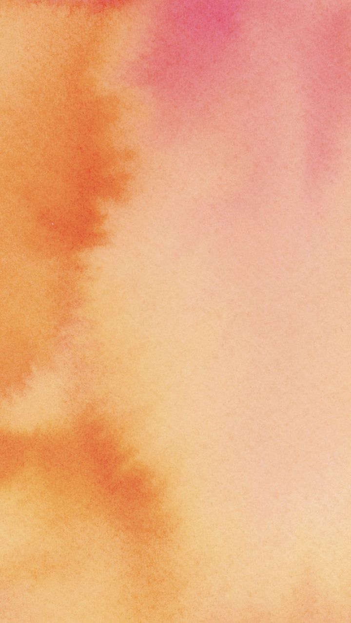 A watercolor background with a mix of orange and pink colors - Warm