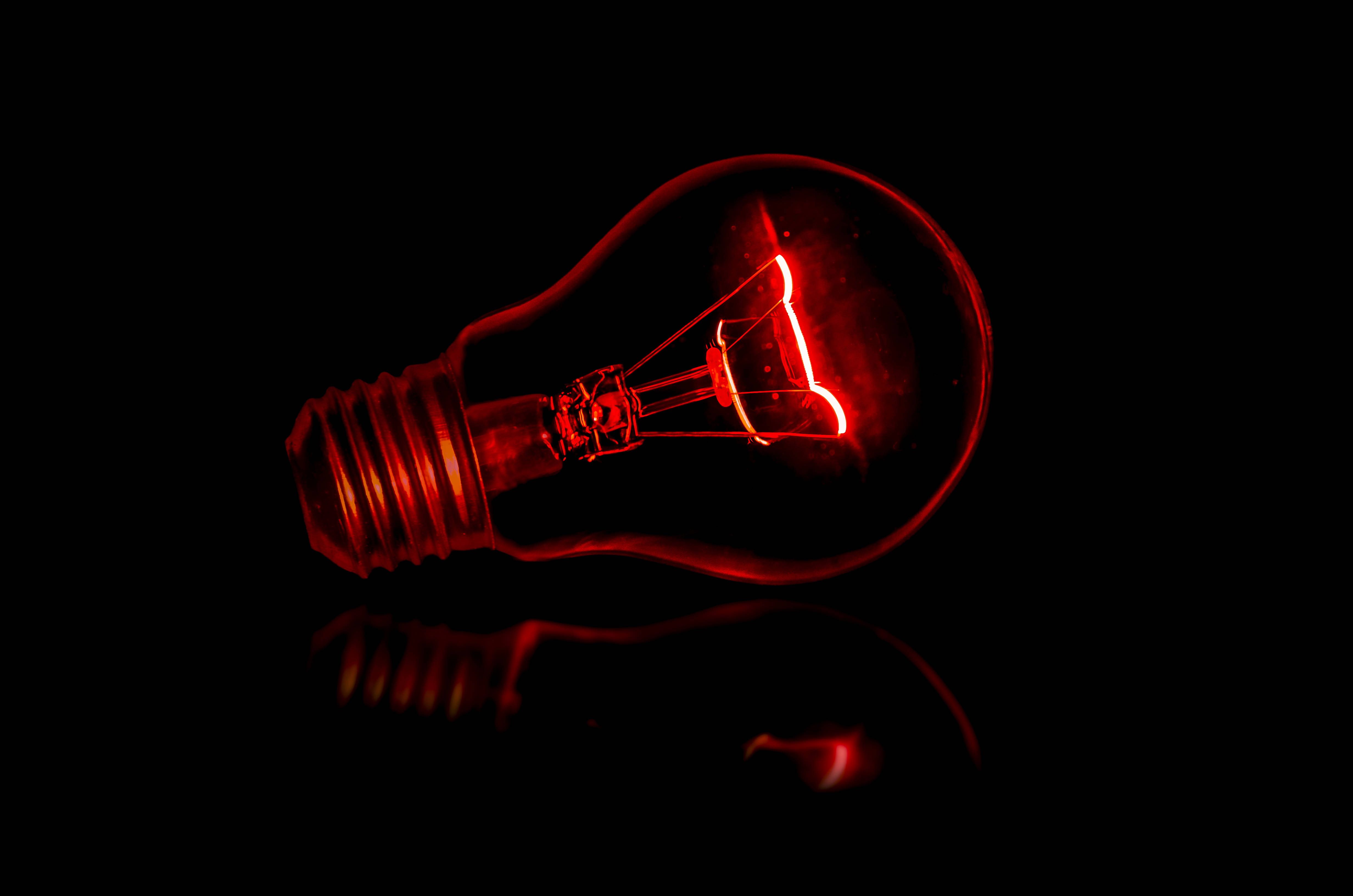 A light bulb that is glowing red - Light red