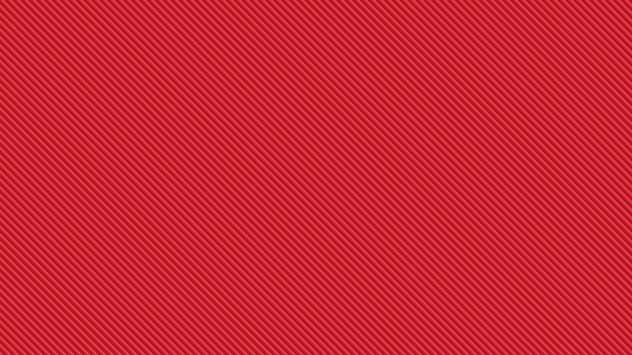 A red background with a diagonal striped pattern. - Light red