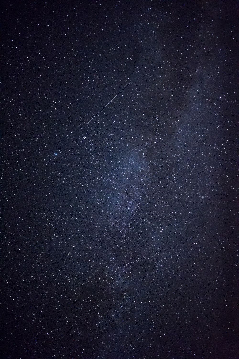 A meteor streaks through the night sky in this long exposure photograph - NASA