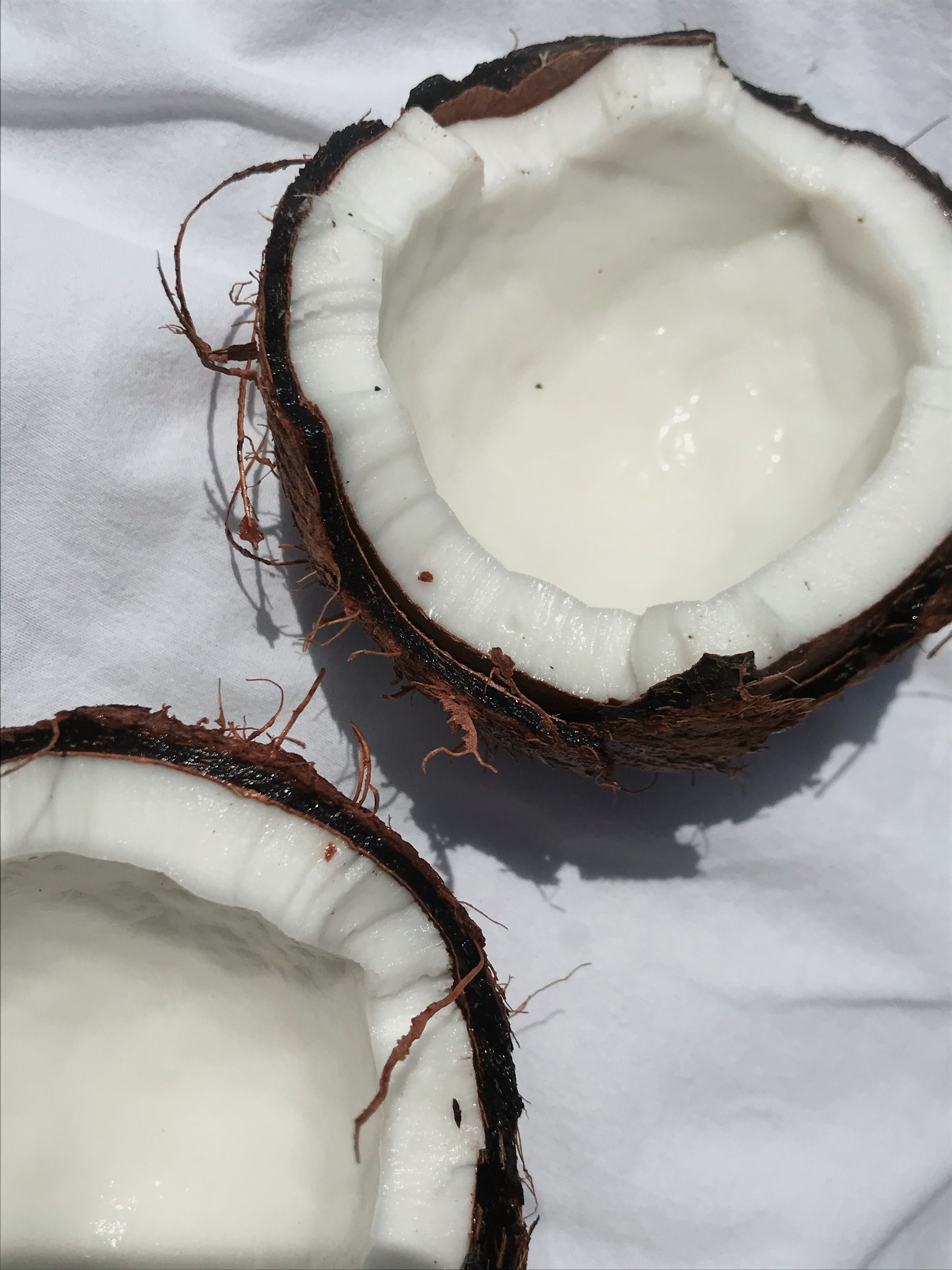 A coconut with the top cut off - Coconut