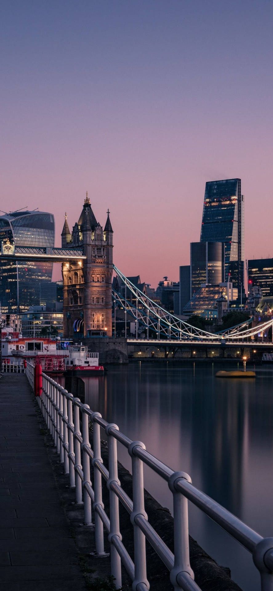 London cityscape at dusk with the Tower Bridge and the River Thames - London