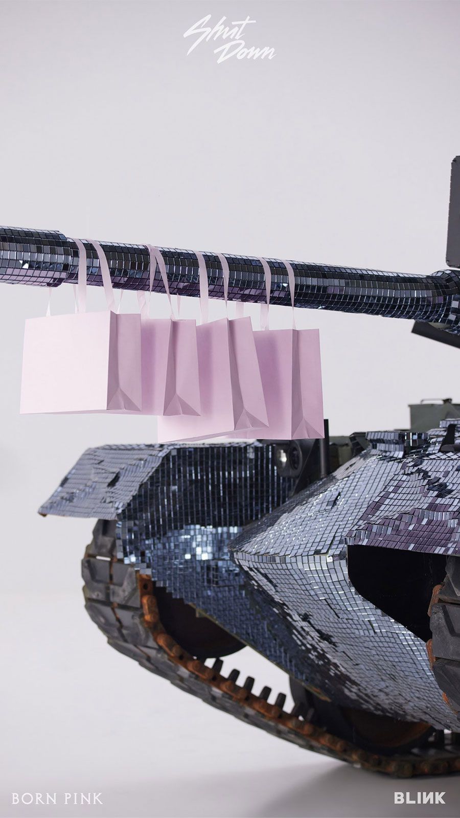 A tank with bags hanging off of it - BLACKPINK