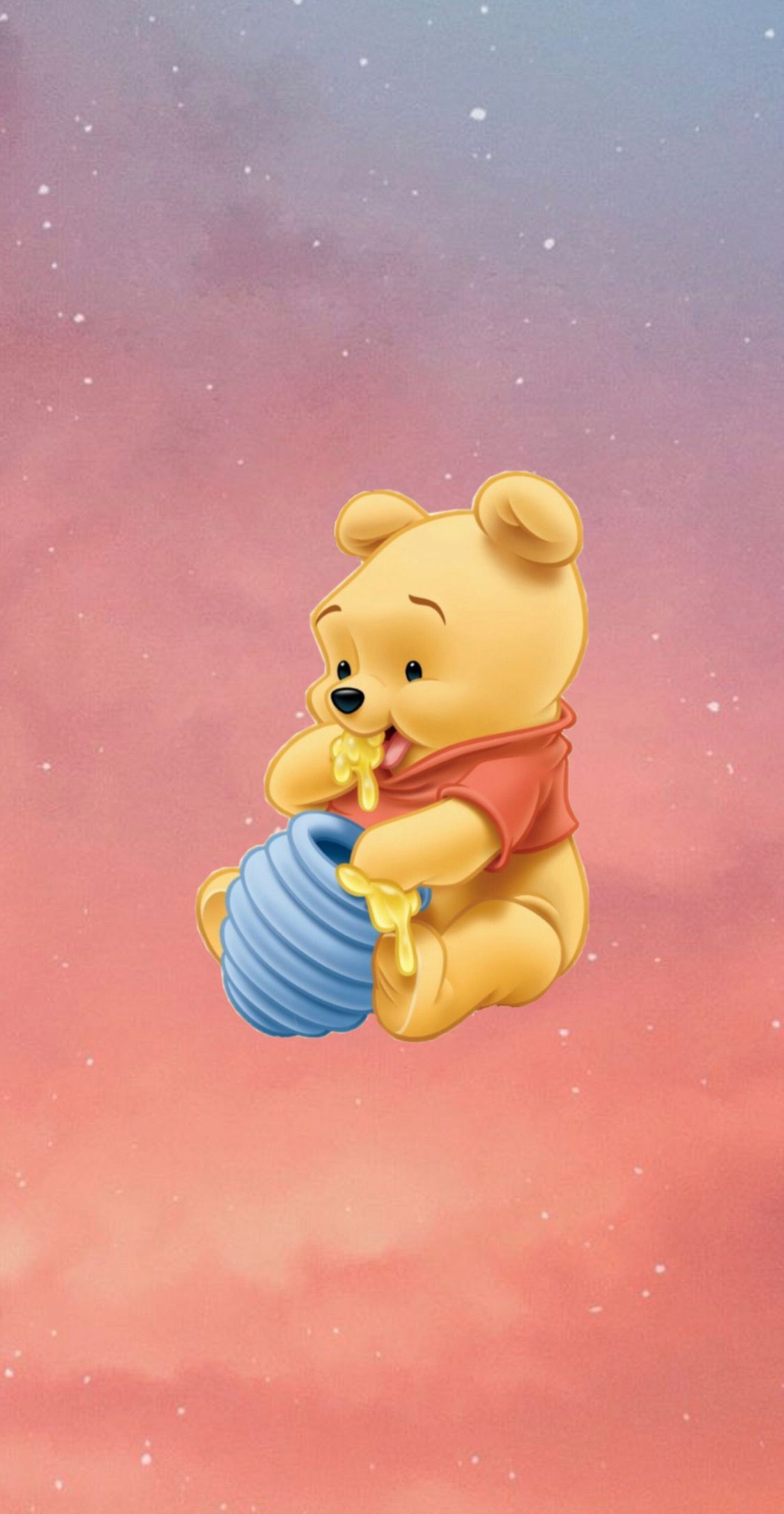 A winnie the pooh character is holding an object in his hand - Winnie the Pooh