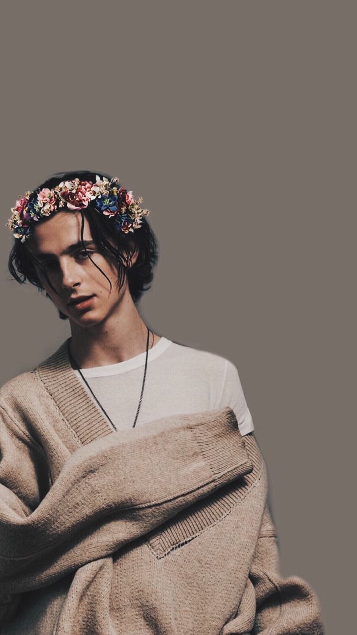 A man with flowers in his hair - Timothee Chalamet