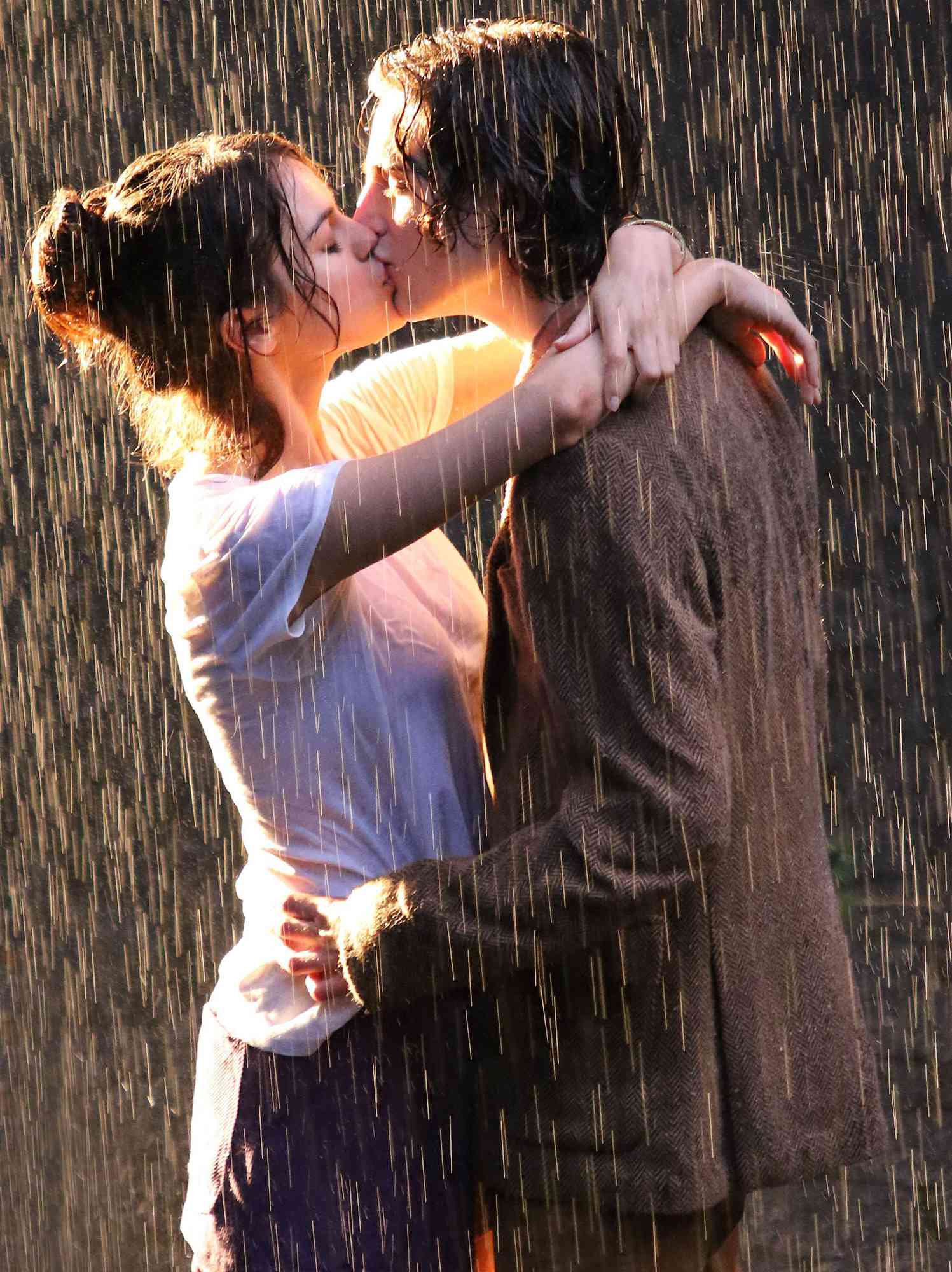 A man and woman kissing in the rain - Timothee Chalamet