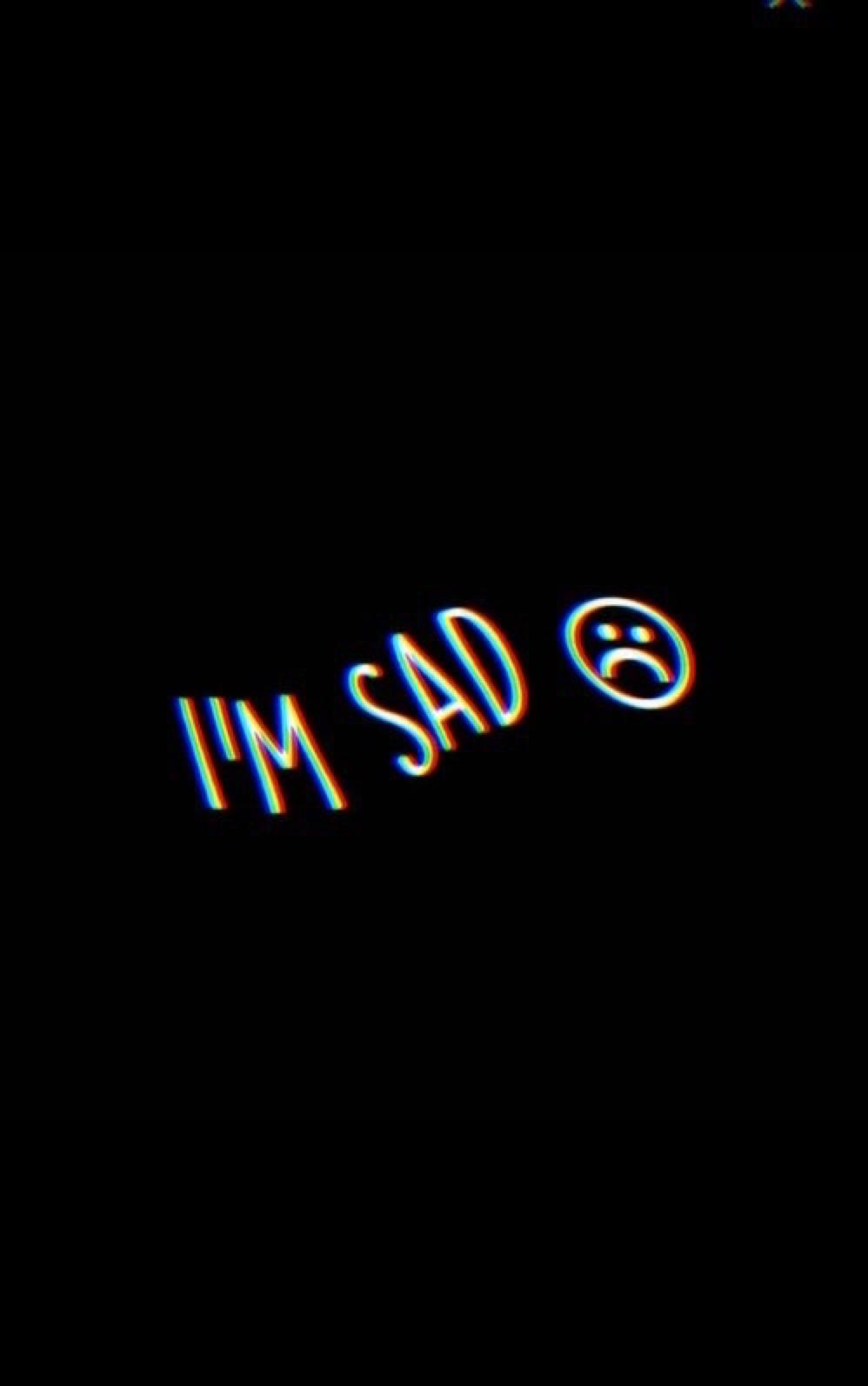 The text ``i'm sad'' is written in neon blue - Sad, depressing