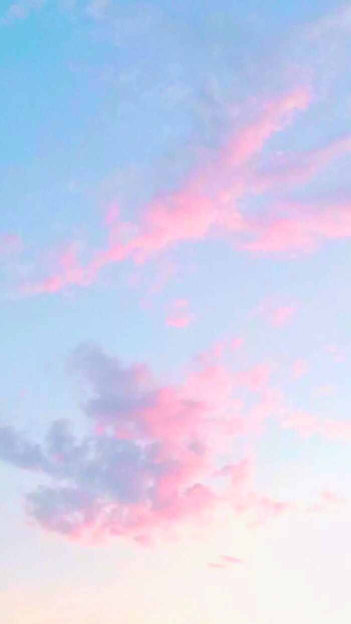 A pink and blue sky with clouds - Colorful